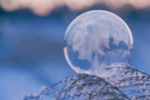 Photo of frozen bubble that can be created by kids in the winter
